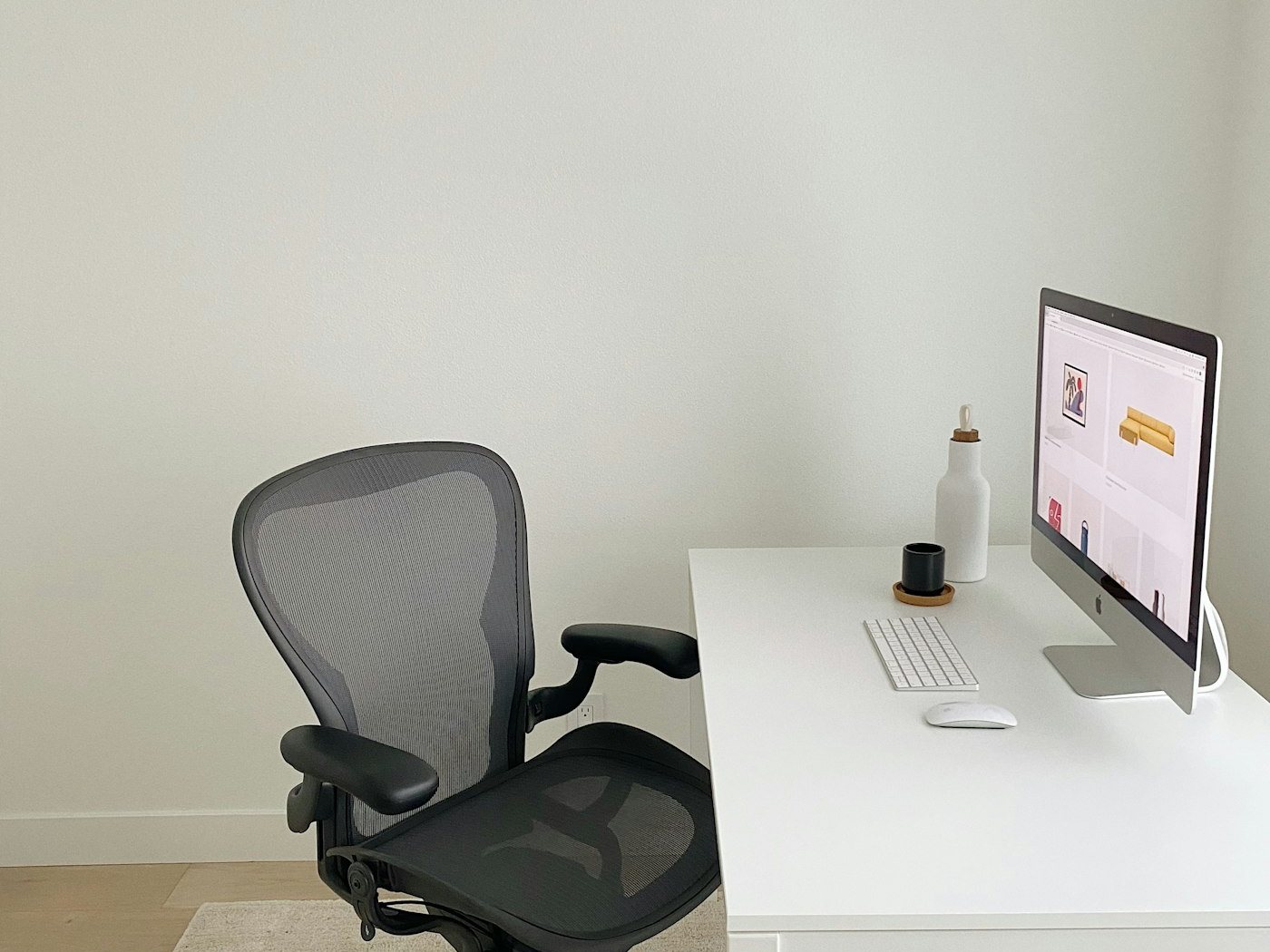 A chair pulled up to a simple desk